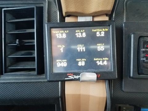1985 Ford Bronco - A digital gauge displays various engine parameters within a vehicle's interior.