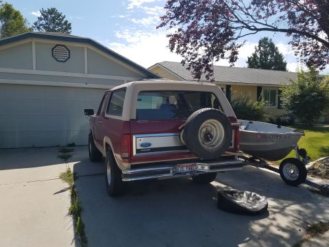 1985 Ford Bronco - This 1985 Ford Bronco is seen from the rear, hitched to a boat trailer and parked in a driveway.