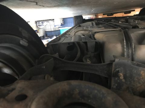 2008 Ford Focus - Undercarriage view of a vehicle, revealing suspension parts and the fuel tank.