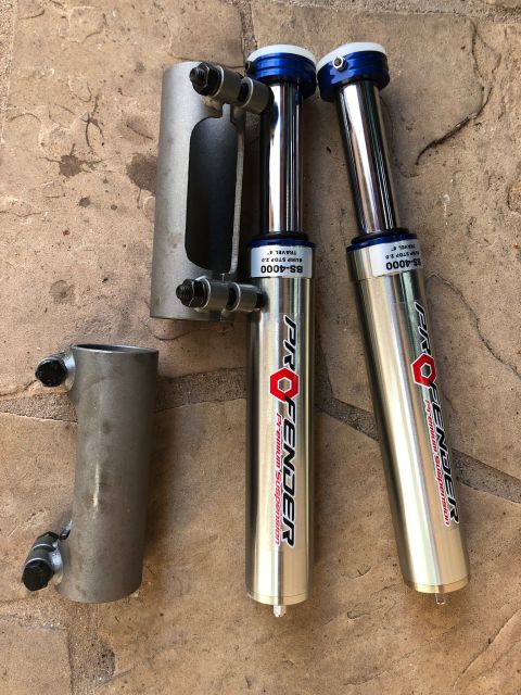 1992 Jeep Wrangler - Two ProFender BS-4000 shock absorbers are shown, along with a separate mounting bracket.