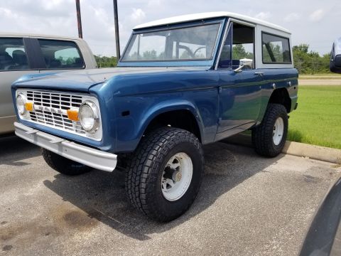 1974 Ford Bronco - Less tire, and MUCH better: Cooper Discoverer AT3 32x11.50R15, and it's aligned. Next stop: exhaust. The auto hub locks work great.
