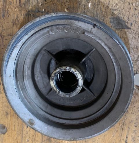 2002 Ford Ranger - Close-up of a metal pulley part with part number markings visible.