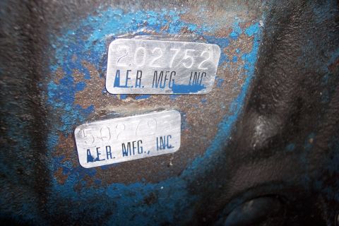 1978 Ford Bronco - Close-up of two metal identification tags affixed to a painted surface.