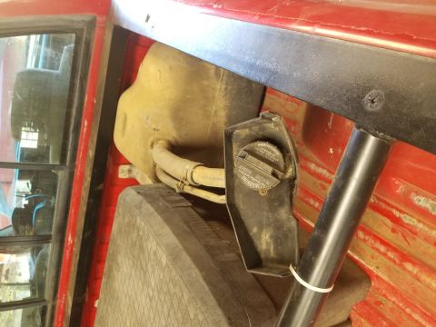 1996 Dodge 1500 - The windshield washer fluid reservoir and cap are visible inside the 1996 Dodge 1500.