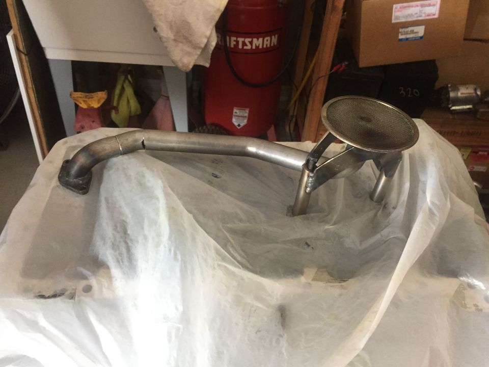 Oil pan and pickup tube assembly