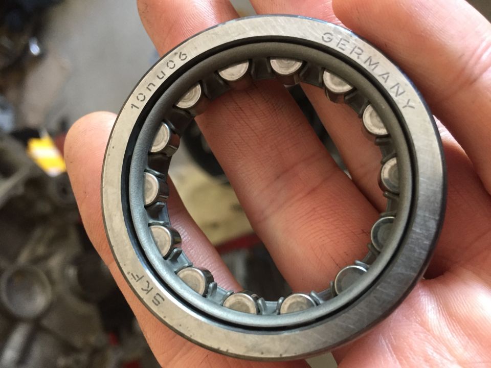 Ball bearing with SKF and GERMANY markings, held by fingers
