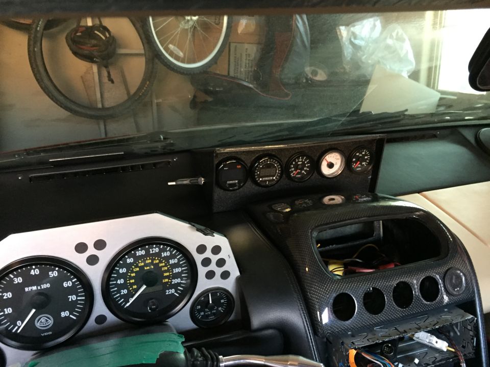 Interior dashboard with Lotus gauges and carbon fiber trim. 2000 Lotus Esprit