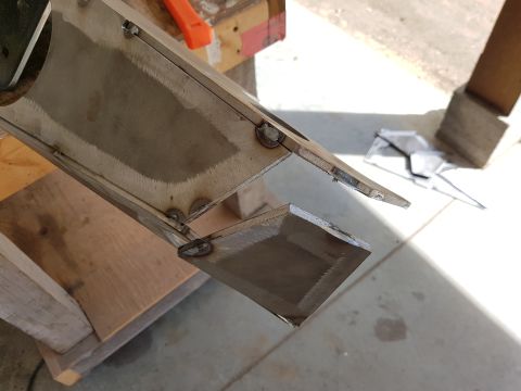 1978 Ford Bronco - Close-up of a metal bracket undergoing fabrication or repair work.
