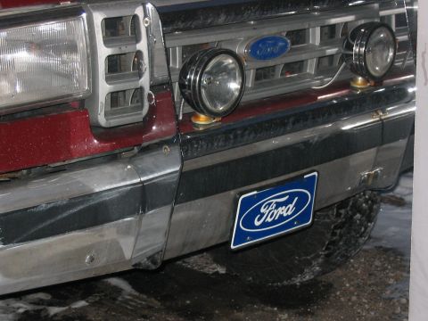 1989 Ford Bronco - Front Blue Ford Plate and KC Daylighters on the Factory Chrome Bull Bumper