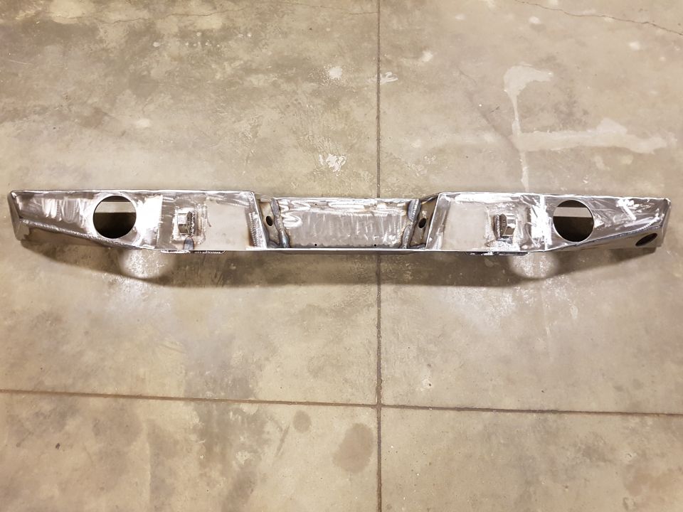 Custom rear bumper with dual exhaust cutouts and license plate mount