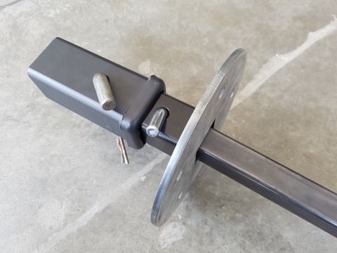 1978 Ford Bronco - Close-up of a trailer hitch receiver and mounting plate assembly.