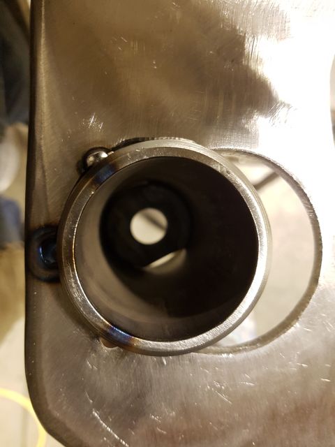 1978 Ford Bronco - A close-up view of a metal part with visible welding marks and a circular opening.