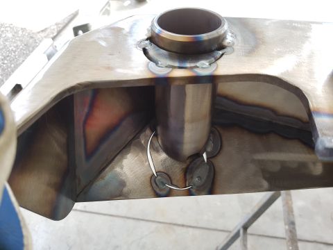 1978 Ford Bronco - This is a close-up view of a custom metal part, showing detailed welding work and a pipe connection.
