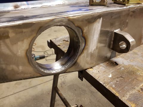 1978 Ford Bronco - Close-up of a custom-welded metal frame section, a large circular opening and a mounting bracket.