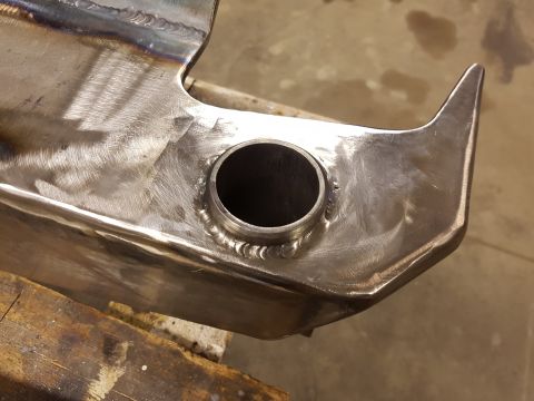 1978 Ford Bronco - Custom metal fabrication with a welded tube fitting, likely for a vehicle project.