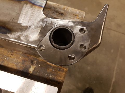 1978 Ford Bronco - A custom exhaust pipe flange is shown, ready for installation on a vehicle's exhaust system.