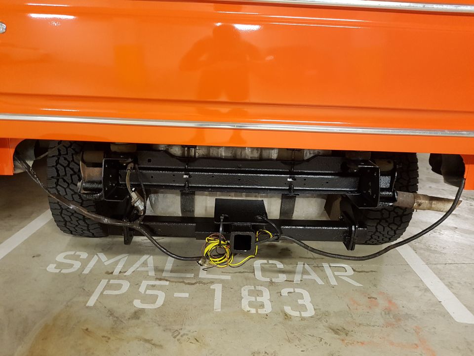 Orange vehicle rear hitch and exhaust system
