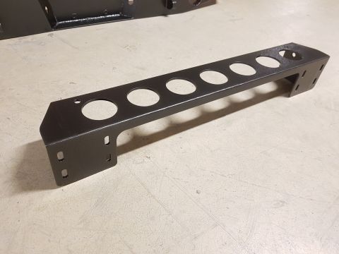1978 Ford Bronco - This black metal bracket features multiple circular cutouts and mounting points.