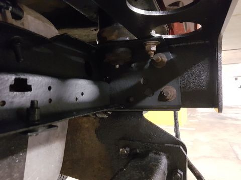 1978 Ford Bronco - Undercarriage view of vehicle frame and suspension components, showing bolts and brackets.