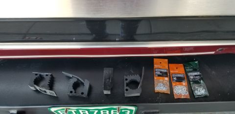 1996 Ford Bronco - Various clips and fasteners are laid out on a surface, possibly for organizing tools.
