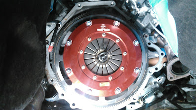 2017 Ford Mustang - Close-up view of a red clutch assembly, possibly from a performance vehicle, with 'Marvic' branding visible.