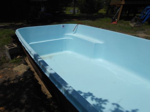 1992 Ford Bronco - This image shows the interior of a light blue swimming pool, built-in steps.