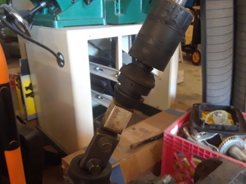 1996 Ford F-350 - Close-up of a steering column universal joint assembly, likely for a vehicle modification.