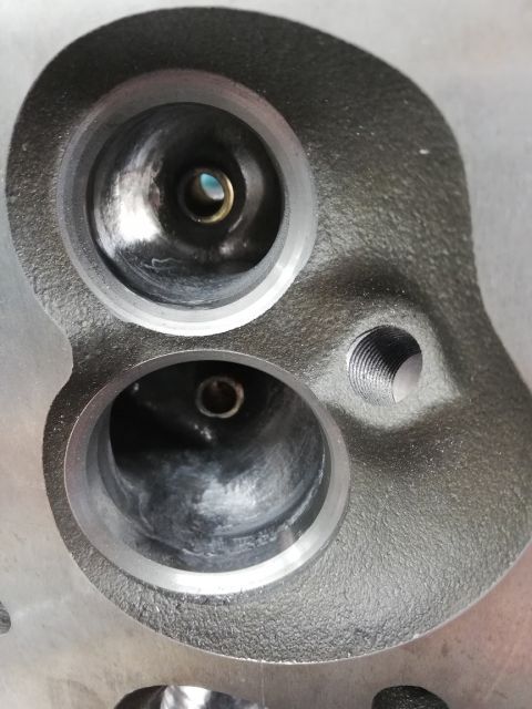 1996 Ford Bronco - This is a close-up view of an engine's cylinder head, showing the intake and exhaust ports.