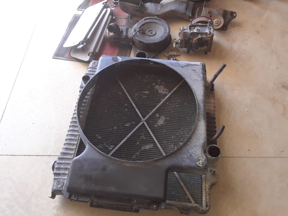 Radiator assembly and other engine components laid out on the floor