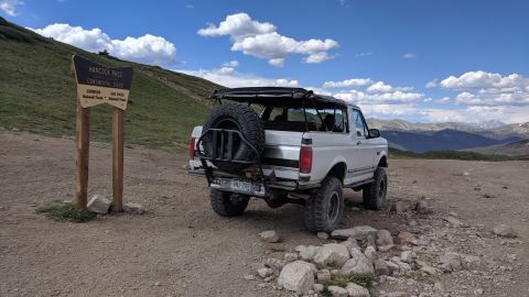 1995 Ford Bronco - White 1995 Ford Bronco with spare tire on rear carrier parked at Hancock Pass, Colorado.