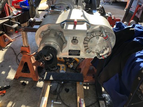 1992 Jeep Wrangler - A close-up view of a transfer case assembly, likely undergoing maintenance or installation.