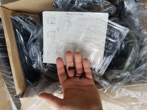 1978 Ford Bronco - A hand holds screws over a diagram showing a fasteners pack.