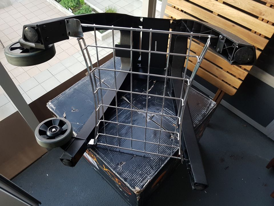 Shopping cart frame with wheels and wire basket