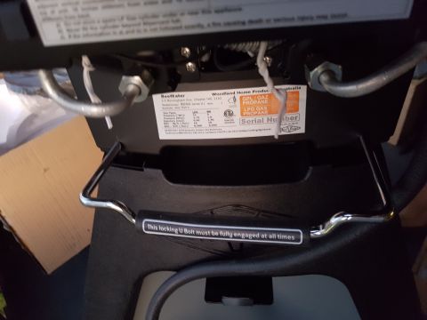 1978 Ford Bronco - A label on a piece of equipment provides propane information and a warning to ensure a locking U bolt is fully engaged.