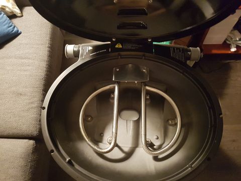 1978 Ford Bronco - Gas grill interior with burner tubes and warning label.