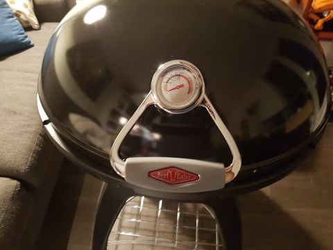 1978 Ford Bronco - A black barbecue grill with a built-in thermometer and a chrome handle the BeefEater brand logo is shown.