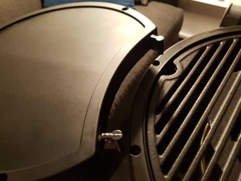 1978 Ford Bronco - Detail of a grill's cooking surface and lid, with a visible hinge.