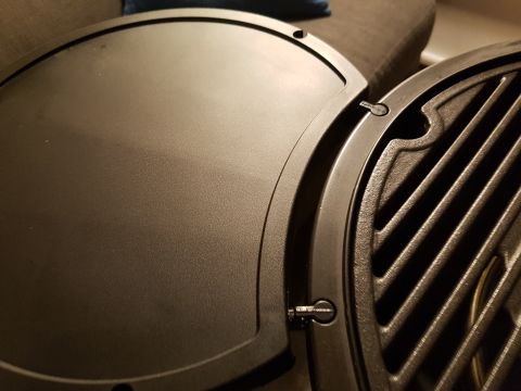 1978 Ford Bronco - Close-up view of two sections of a black grill, one parallel slats.