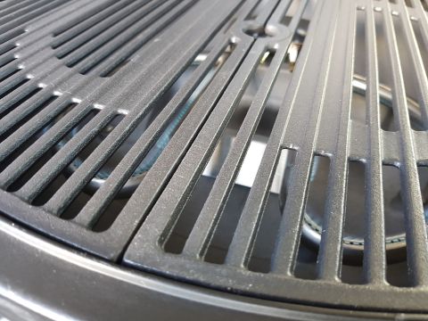 1978 Ford Bronco - Cast iron grill grates are shown in a close-up view, with a burner visible underneath.