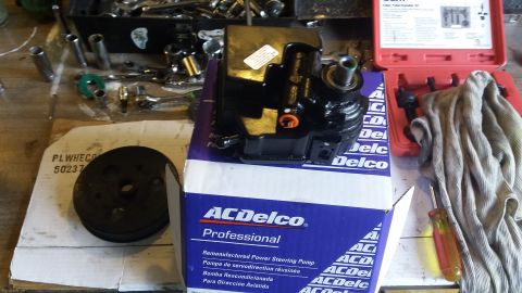 ACDelco remanufactured power steering pump on box, with pulley and tools