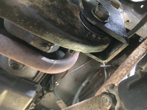 1996 Ford Bronco - Close-up view of the undercarriage, focusing on mechanical components and exhaust system.