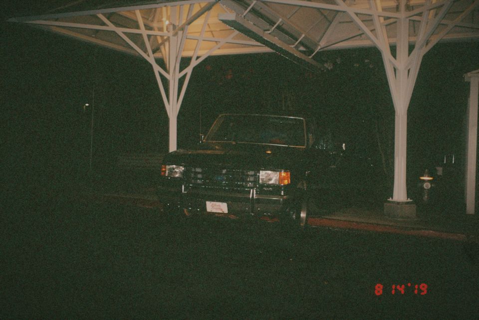 1988 Ford Bronco front view parked under a canopy