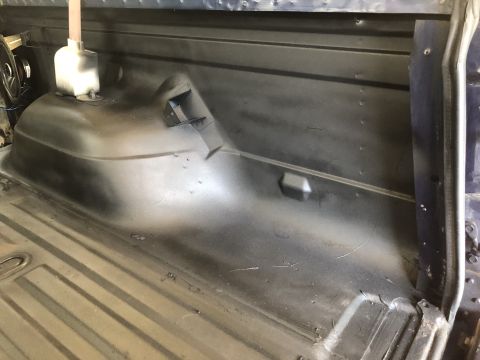 1995 Ford Bronco - The interior cargo space of a vehicle, likely a truck or SUV, is shown after some work has been done.