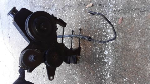 1994 Ford Bronco - Power steering pump assembly removed from a vehicle.