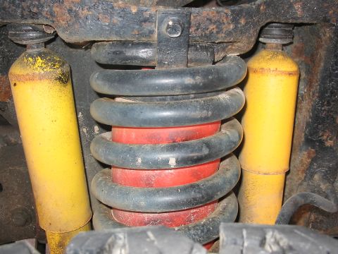 1989 Ford Bronco - Good shot of the twin yellow shocks and the red air bag inside of the front spring.