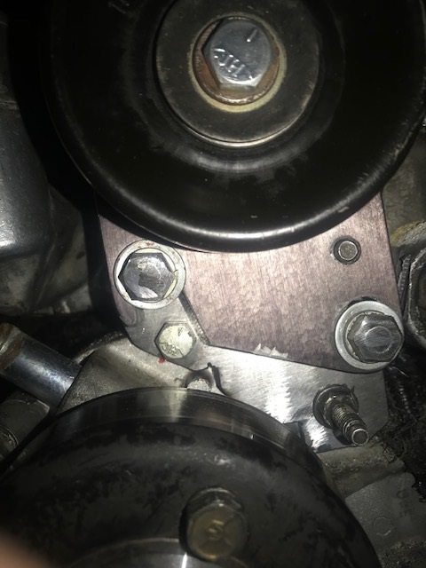 2000 Ford Explorer - Close-up view of an engine's pulley system components.