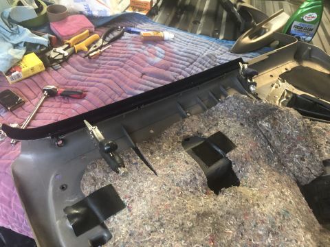 1995 Ford Bronco - Door panel removed for interior work, with tools and supplies visible.