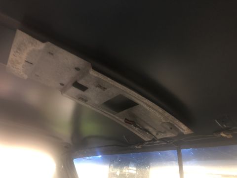 1995 Ford Bronco - Headliner support bracket and wiring in a vehicle interior.