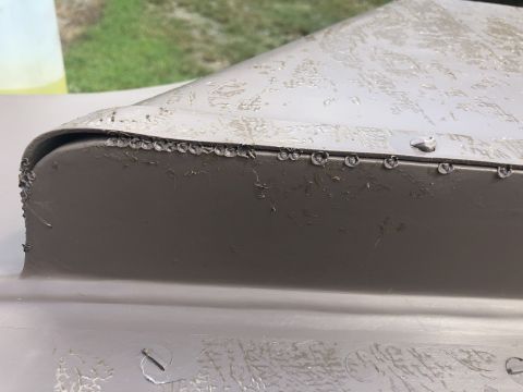 1995 Ford Bronco - Detail of vehicle interior trim, showing rivets along the edge and some surface texture.