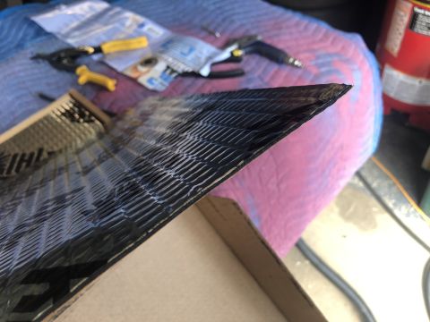 1995 Ford Bronco - Sound deadening material is being installed, with tools visible in the background.